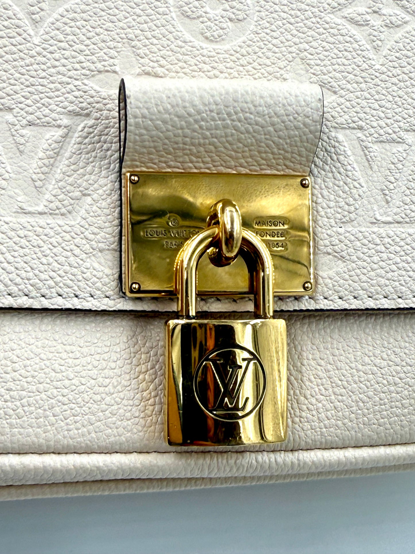 Louis Vuitton Marignan Monogram Empreinte creme