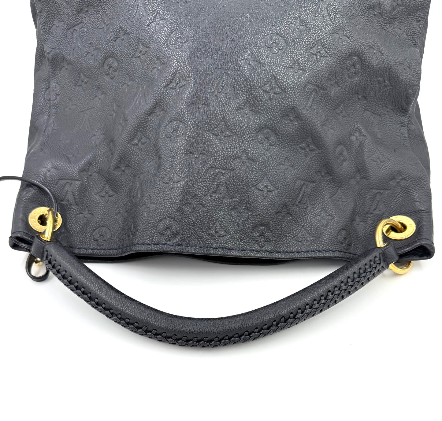 LOUIS VUITTON Artsy MM Monogram Empreinte Infini schwarze Lederhandtasche mit goldenen Details und geprägtem Logo.