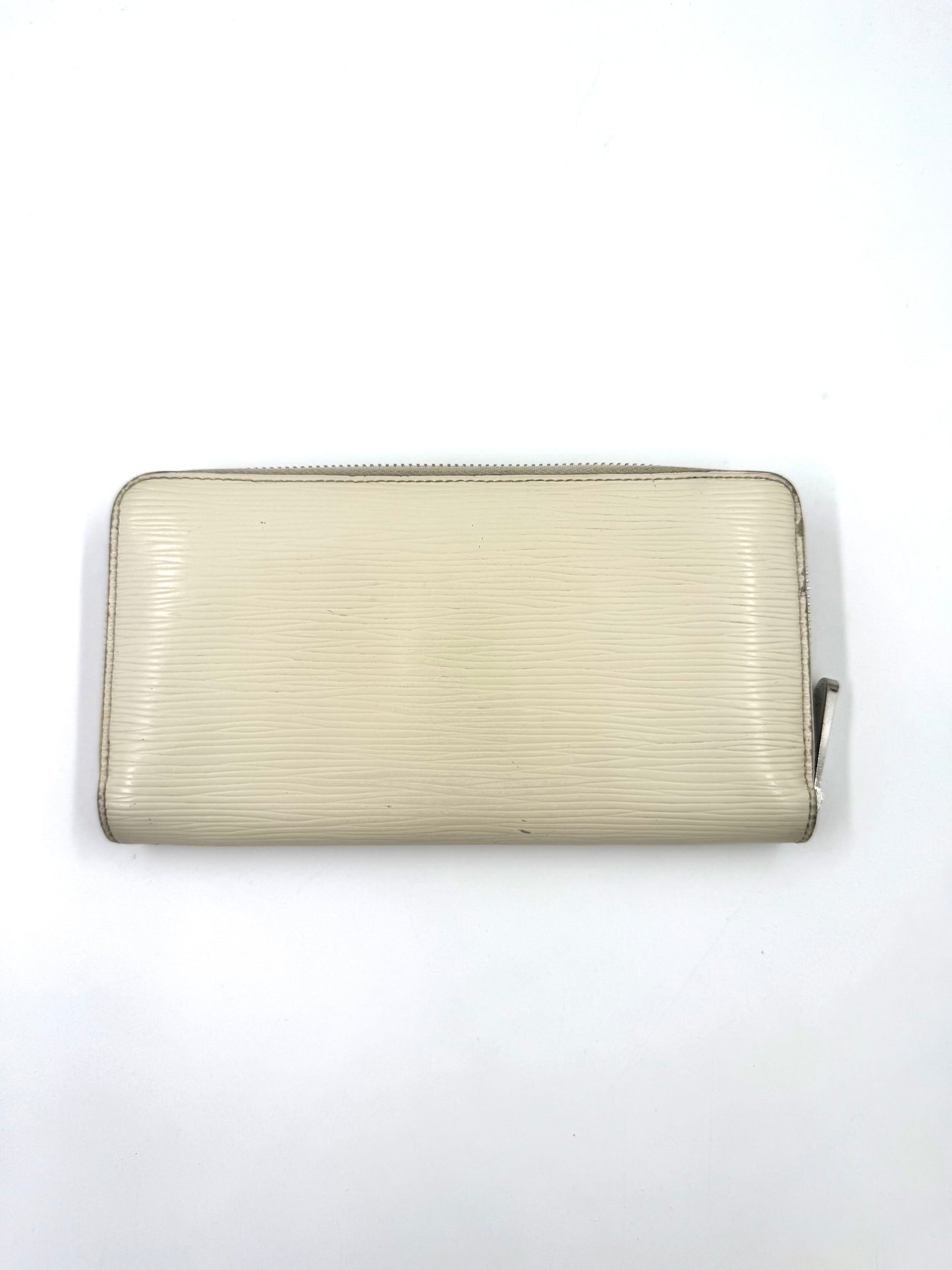 LOUIS VUITTON Zippy Epi ivory Portemonnaie aus Epileder mit leichten Gebrauchsspuren und glänzenden Metallbeschlägen.