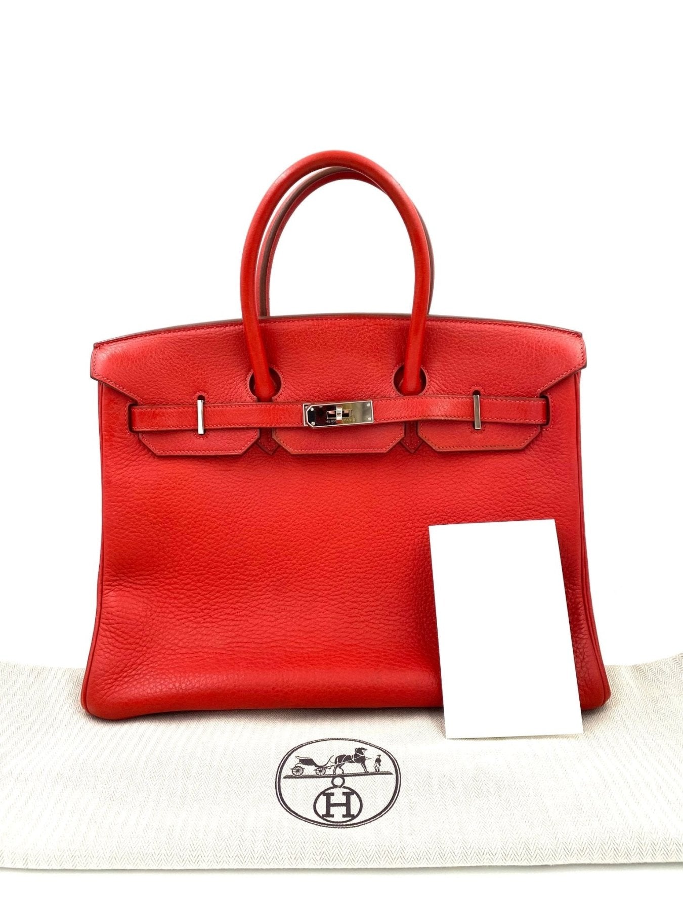 HERMES Birkin 35 Clemence Leder Capucine Handtasche aus rotem Leder mit Palladium-Hardware auf weissem Staubbeutel