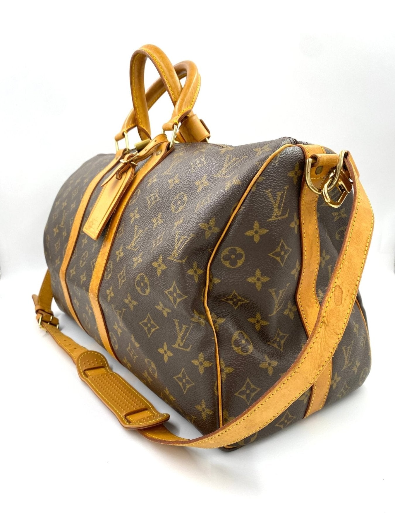 Louis Vuitton Keepall 45 Bandouliere Reisetasche aus Monogram Canvas mit Schulterriemen und honigfarbenen Lederdetails
