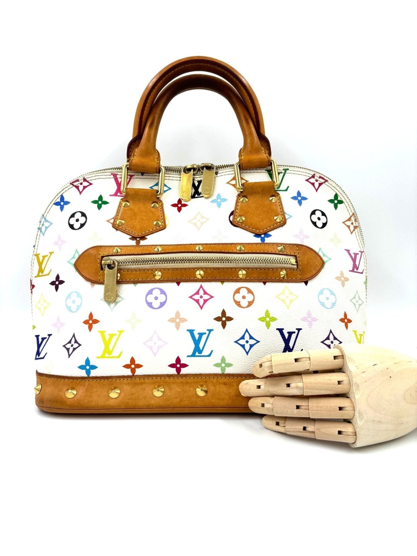 Louis Vuitton Alma Multicolor Handtasche mit buntem Monogram Muster, braunen Ledergriffen und Reissverschluss auf weissem Grund