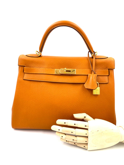 HERMÈS Kelly 32 Retourne orange Togo Leather mit Gold Hardware