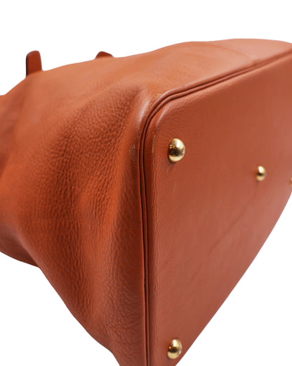 HERMÈS Thar GM Clemence Gold aus braunem Leder mit goldfarbenen Details