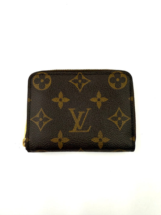 LOUIS VUITTON Zippy Coin Monogram Canvas kleines Portemonnaie aus braunem Monogram Canvas mit Reißverschluss.