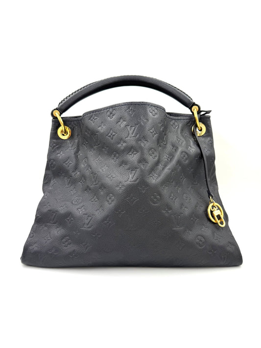 LOUIS VUITTON Artsy MM Monogram Empreinte Infini Handtasche aus schwarzem Leder mit goldfarbenen Details.