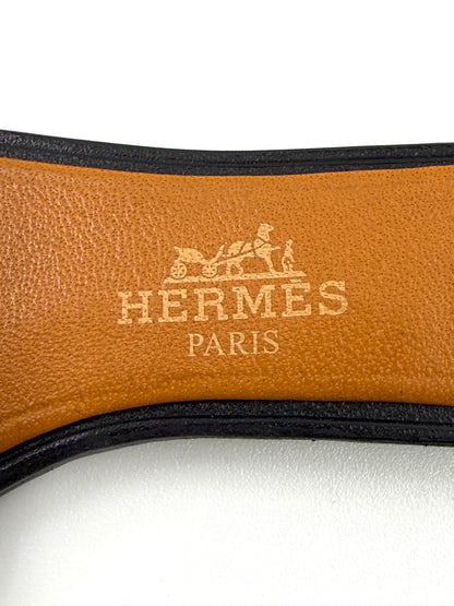 HERMÈS Oran Nano Anhänger aus braunem und schwarzem Leder mit geprägtem Hermès Paris Logo