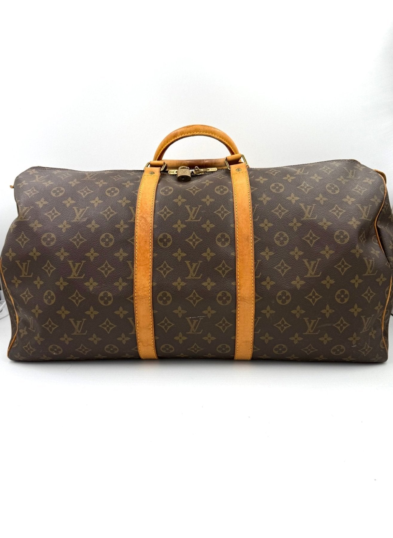 Louis Vuitton Keepall 55 Reisetasche im klassischen Monogram Canvas Muster mit braunen Lederriemen und Griffen