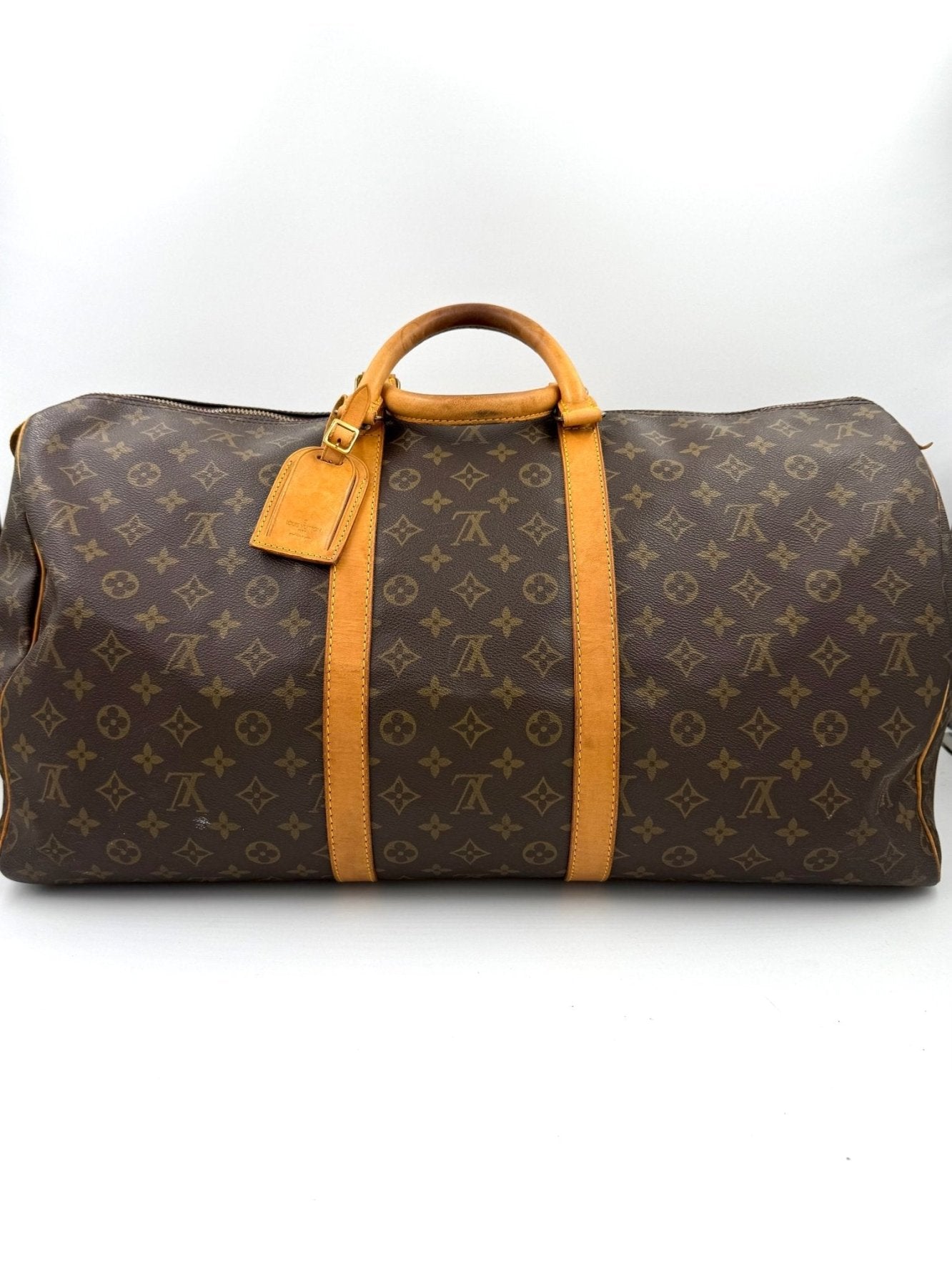 Louis Vuitton Keepall 55 Reisetasche aus Monogram Canvas mit braunen Lederdetails und goldenen Beschlagen