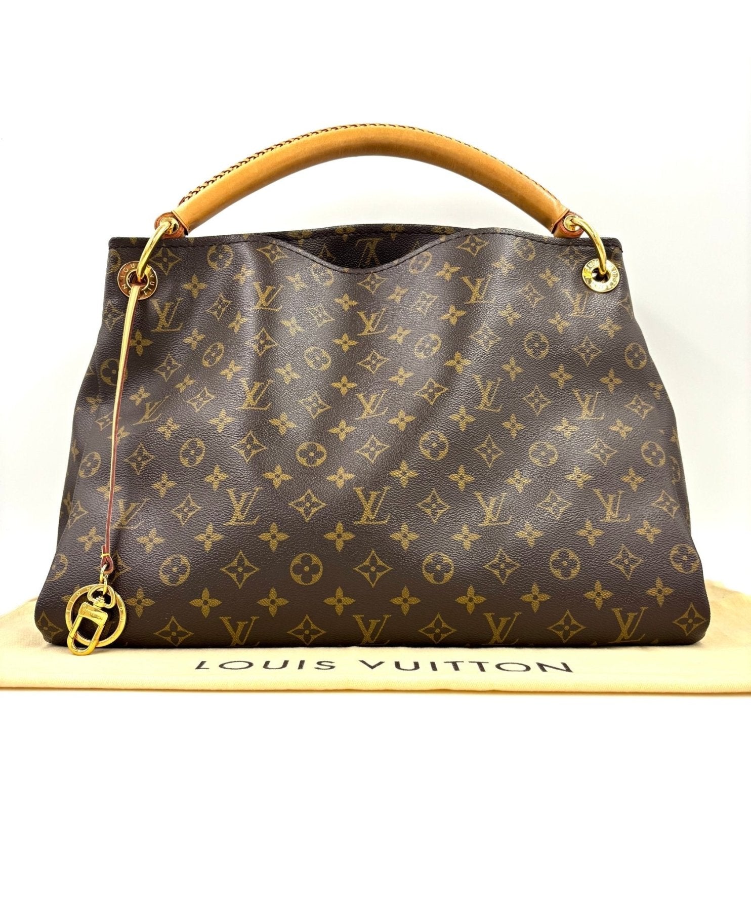 Louis Vuitton Artsy MM Handtasche aus Monogram Canvas mit geflochtenem Ledergriff, auf weissem Hintergrund fotografiert