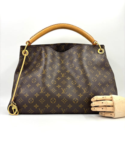 Louis Vuitton Artsy MM Monogram Canvas Handtasche mit geflochtenem Ledergriff und klassischem LV Muster, seitlich fotografiert
