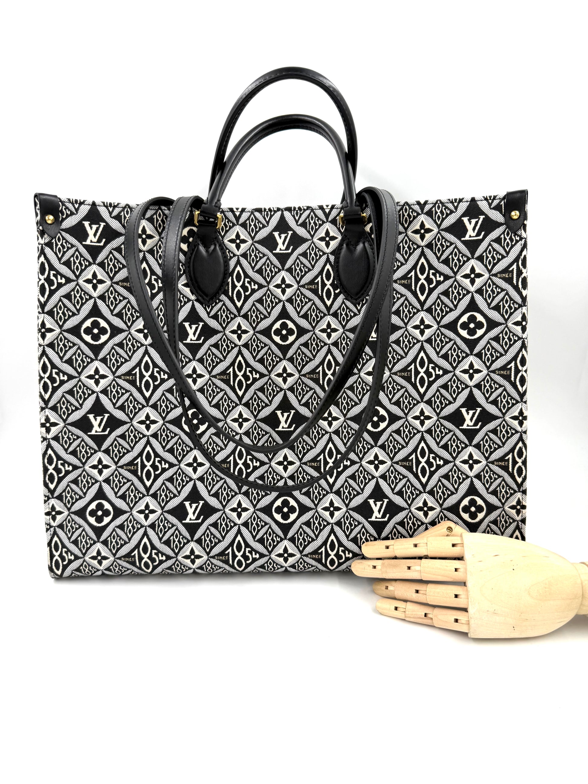 LOUIS VUITTON Onthego GM 1854 Edition große Designerhandtasche mit schwarz-weißem Muster und Ledergriffen