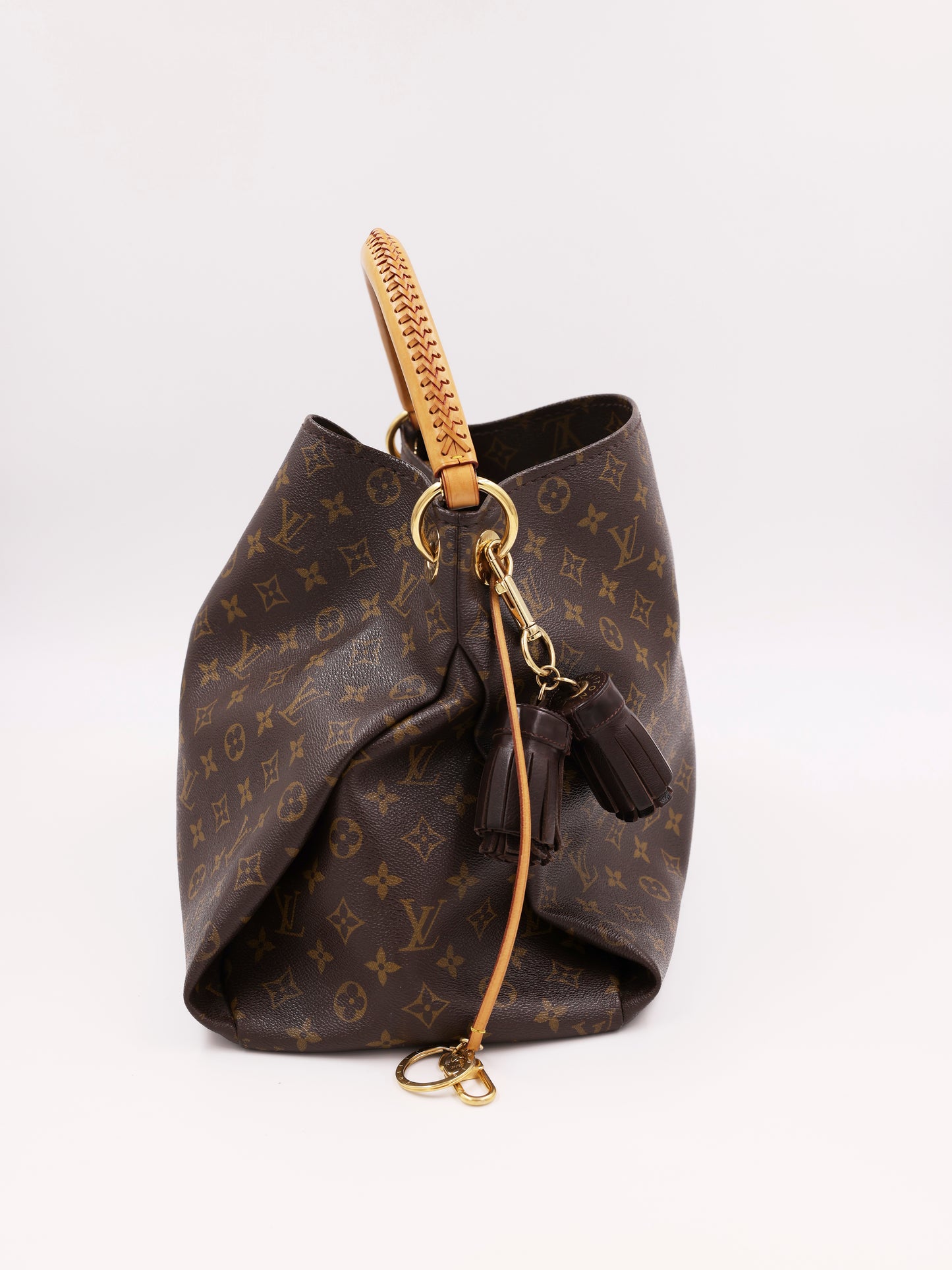 LOUIS VUITTON Artsy MM Monogram Canvas mit Tasselanhänger