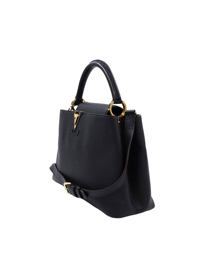 LOUIS VUITTON Capucines MM Taurillon schwarz schwarze Designerhandtasche mit goldfarbenen Details
