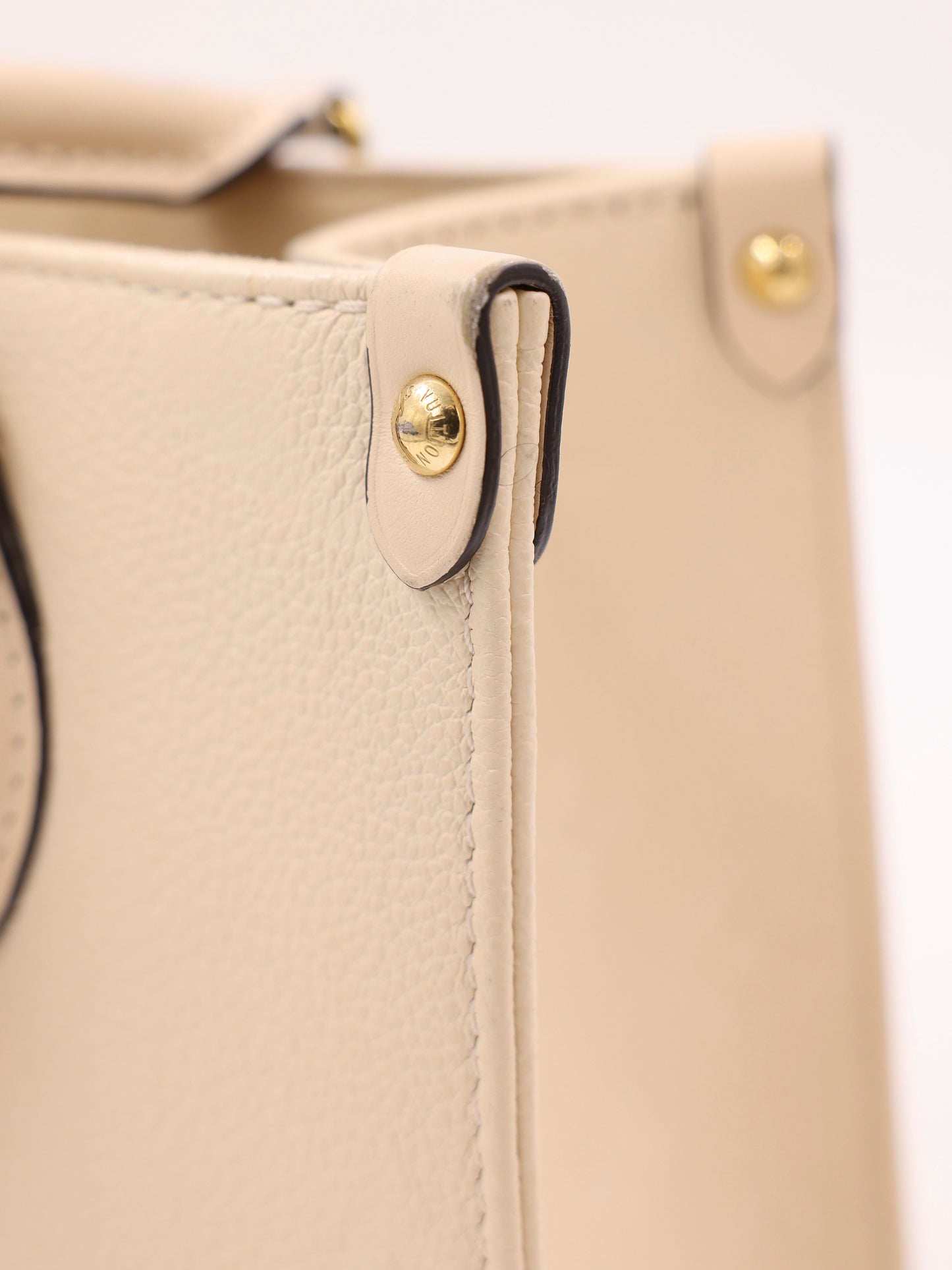 LOUIS VUITTON OnTheGo PM Monogram Empreinte Leder creme