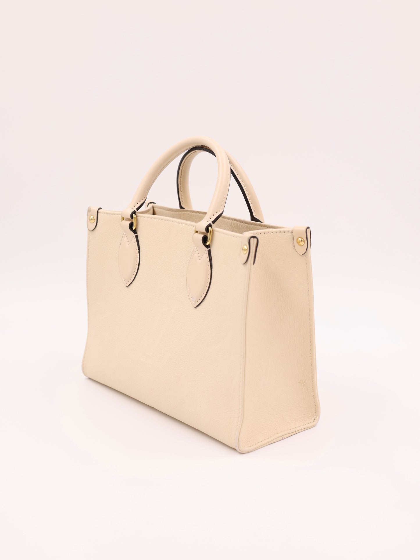 LOUIS VUITTON OnTheGo PM Monogram Empreinte Leder creme
