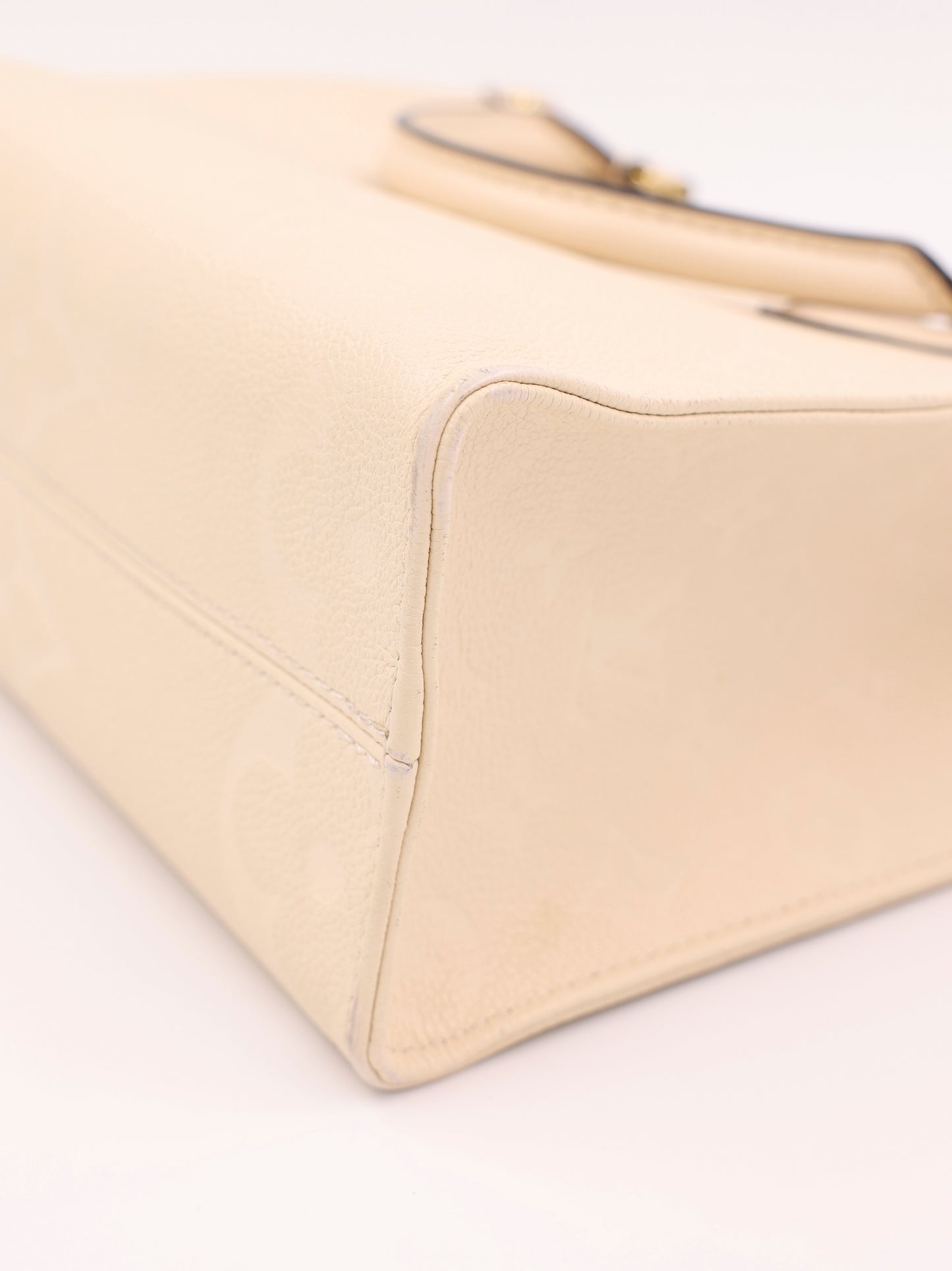 LOUIS VUITTON OnTheGo PM Monogram Empreinte Leder creme