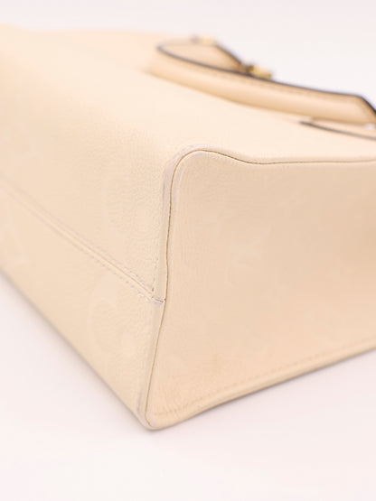 LOUIS VUITTON OnTheGo PM Monogram Empreinte Leder creme