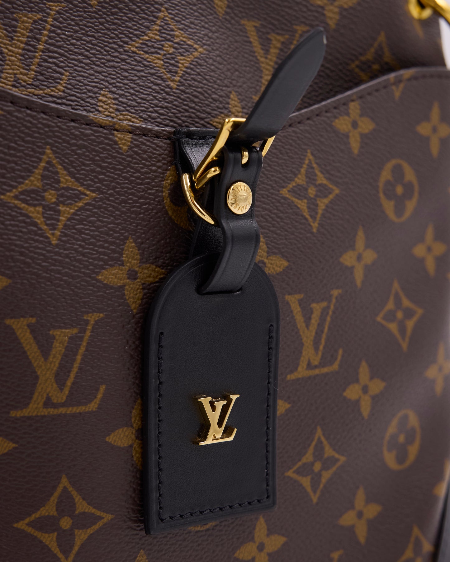 Louis Vuitton Odeon Monogram Canvas schwarz mit schwarzem Lederanhänger